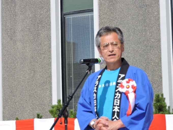 Yoshi Ogawa gives welcoming remarks