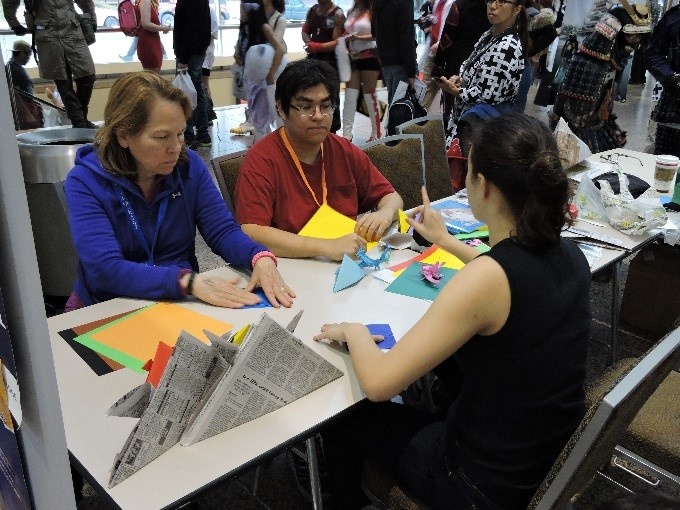 Attendees learning origami